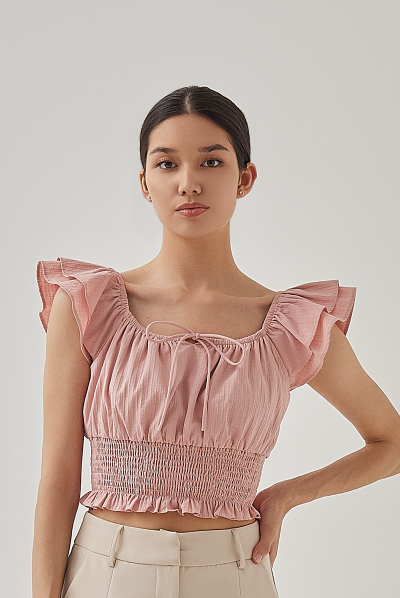 Cove Flutter Sleeves Smocked Crop Top in Dusty Pink