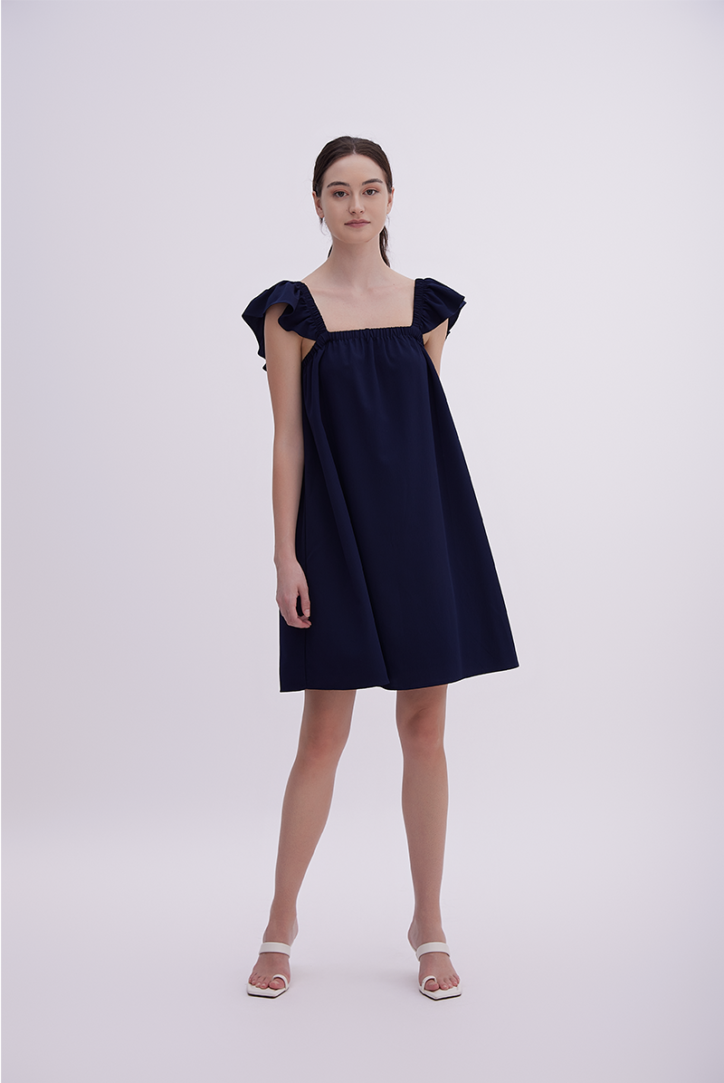 Isla Sleeveless Flutter Dress in Navy Blue