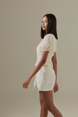 Carinne Peplum Top in Cream