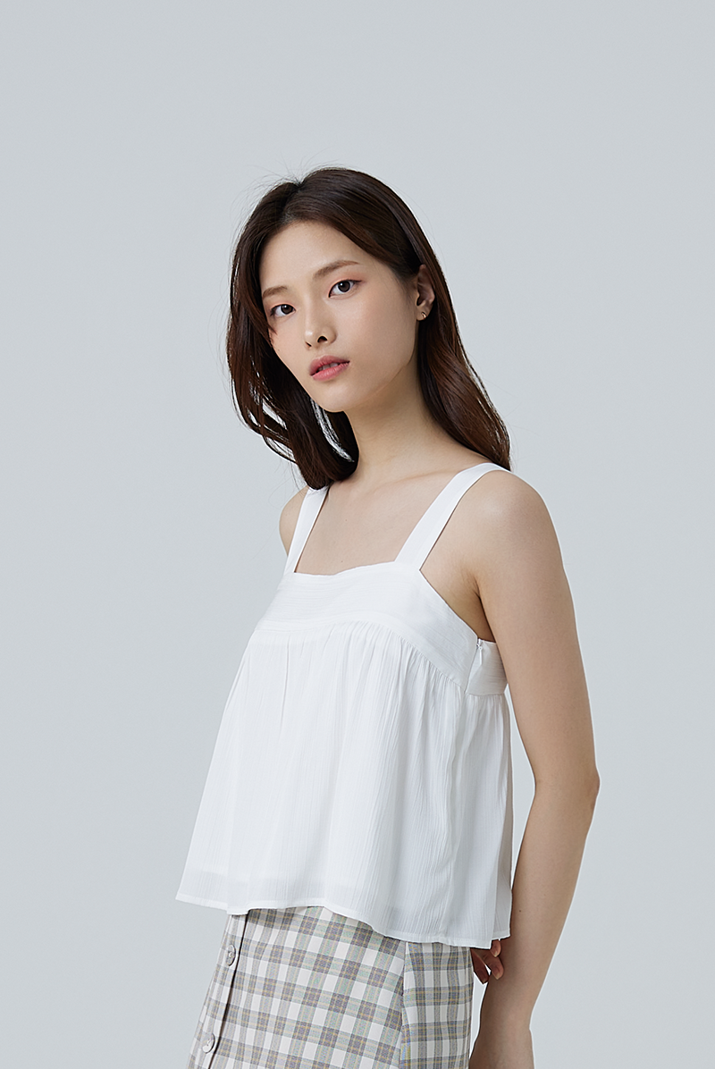 Everly Sleeveless Flowy Blouse in White